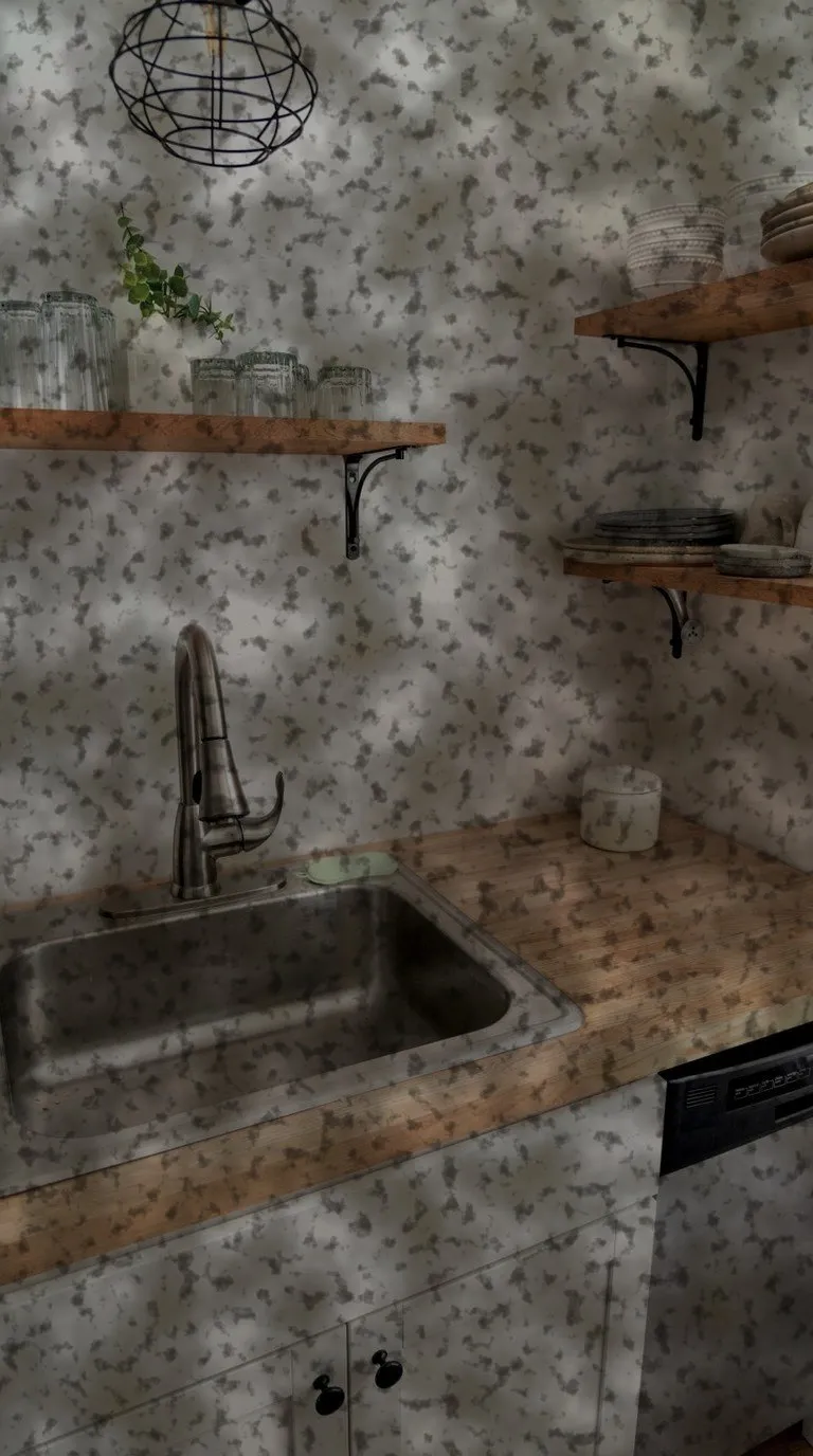 A kitchen sink and counter under a greasy yellow film, heaviest across the worktop